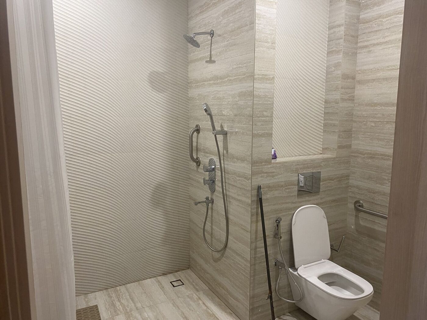 Private en-suite bathroom with walk-in shower in India