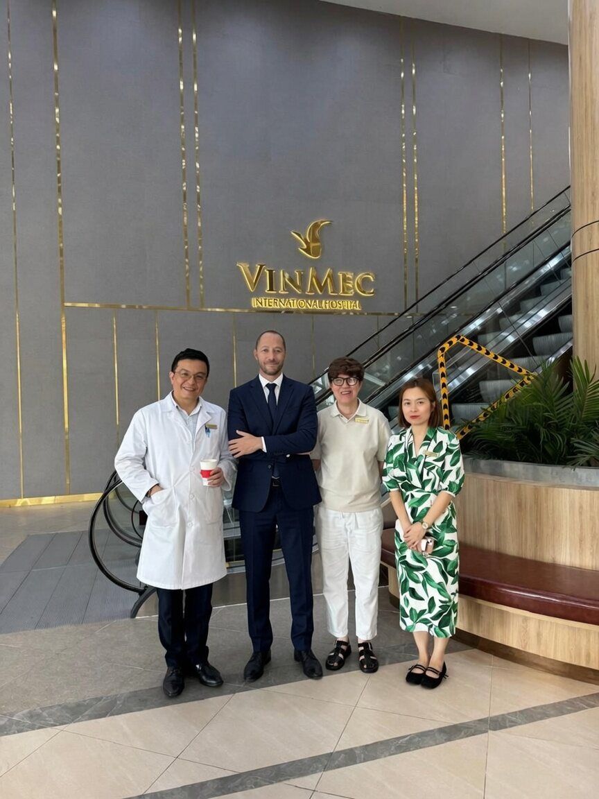 Our founder with partner physicians at a partner hospital in Vietnam